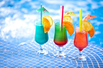 Refreshing cocktail drinks by the swimming pool