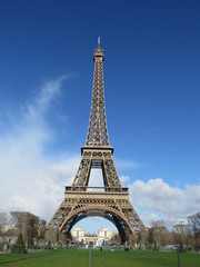View of the Eiffel Tower in the morning with blue sky in the background