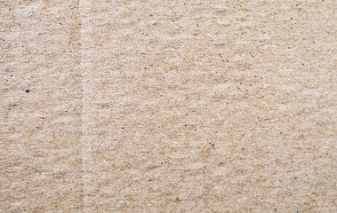 Crumpled brown cardboard. Texture. Background. Front view. Closeup