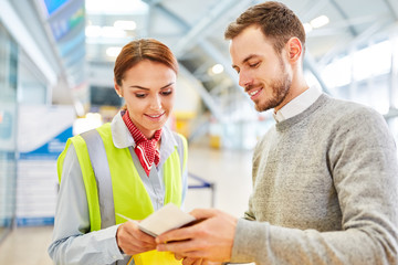 Service clerk at the airport Check-in controlled passport