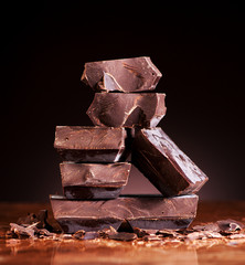 Chopped chocolate on a dark marble background