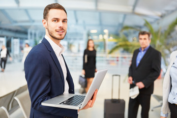 Business man on business trip using laptop computer