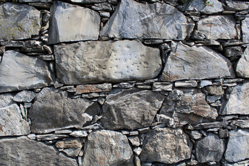Muro di pietra sfondo grigio