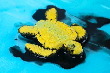 Turtle in oil. pollution in ocean environmental problem. Ecological situation world earth