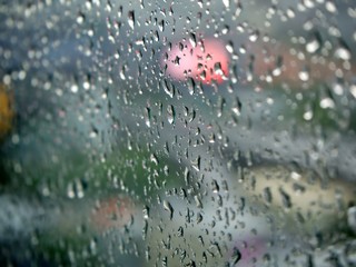 The focus on the water drop on the glass with colorful bokeh background