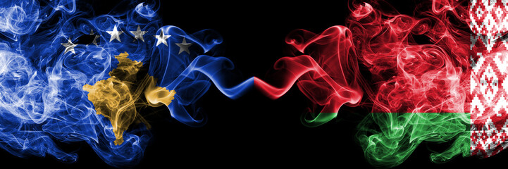 Kosovo vs Belarus, Belarusian smoky mystic flags placed side by side. Thick colored silky smokes combination of Kosovo and Belarus, Belarusian flag