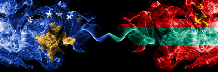 Kosovo vs Transnistria smoky mystic flags placed side by side. Thick colored silky smokes combination of Kosovo and Transnistria flag