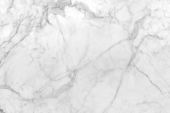 smooth flat marble rock surface patterned  with white and streaks of gray
