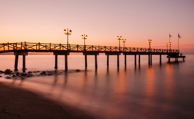 Fototapeta na wymiar Early hours of daylight on the beach of Marbella on the Costa de Sol (Malaga) Spain