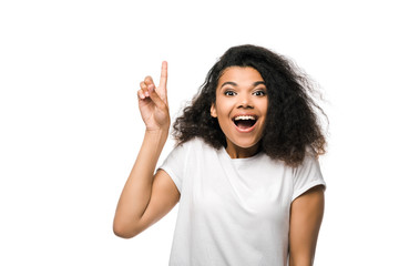 happy african american woman in white t-shirt pointing with finger isolated on white