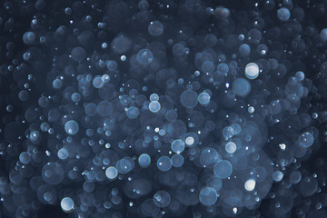 abstract sparkle bokeh light effect with navy blue background