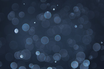 abstract sparkle bokeh light effect with navy blue background
