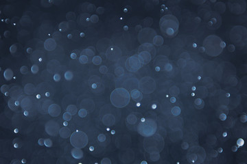 abstract sparkle bokeh light effect with navy blue background