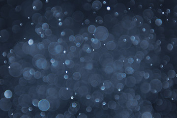 abstract sparkle bokeh light effect with navy blue background