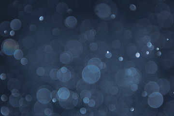 abstract sparkle bokeh light effect with navy blue background