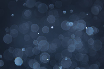 abstract sparkle bokeh light effect with navy blue background