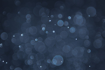 abstract sparkle bokeh light effect with navy blue background