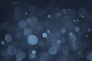 abstract sparkle bokeh light effect with navy blue background