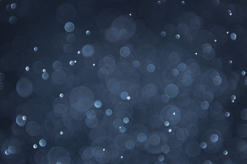 abstract sparkle bokeh light effect with navy blue background