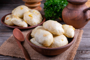 Russian, Ukrainian or Polish dish: varenyky, vareniki, pyrohy. Dumplings, ffilled with cabbage