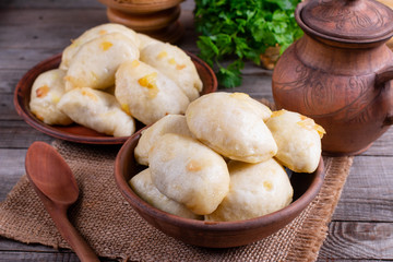 Russian, Ukrainian or Polish dish: varenyky, vareniki, pyrohy. Dumplings, ffilled with cabbage