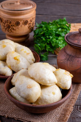 Russian, Ukrainian or Polish dish: varenyky, vareniki, pyrohy. Dumplings, ffilled with cabbage