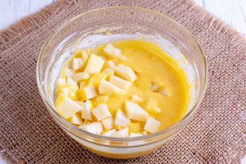 Sliced apples and dough. Cooking sweet pastries