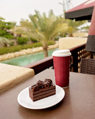 a cup of coffee and a piece of cake