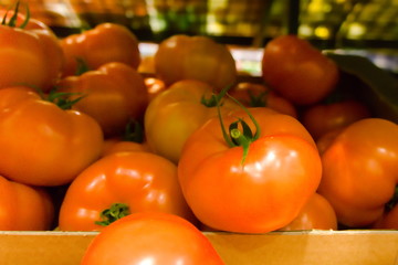 beautiful red ripe tomatoes in the supermarket