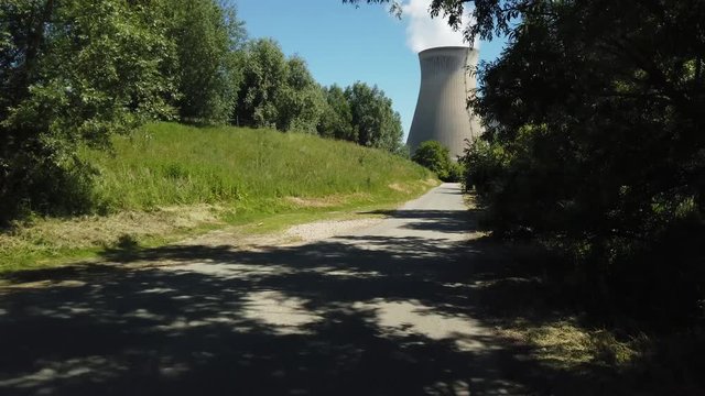 POV driving to Doel Nuclear Power Station with smoking cooling towers