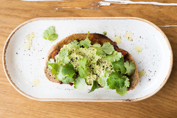 Guacomole avocado toast bread with green salad