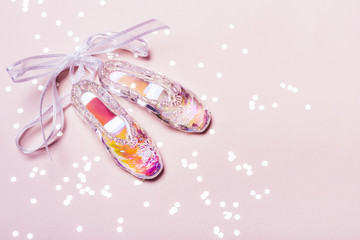 Transparent Holographic Christmas Toy Pointe Shoes and sparkle confetti. Christmas concept