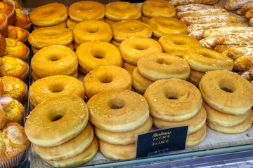 Berlinas, filled doughnuts ready to be sold in a pastry shop