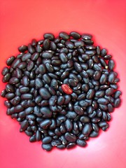 Black beans with red background