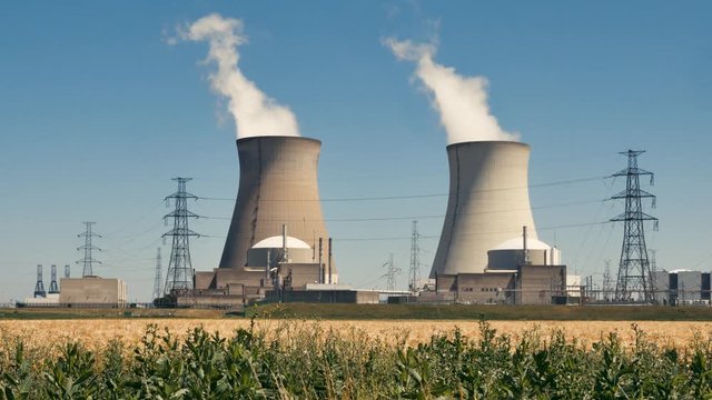 Doel Nuclear Power Station with two smoking cooling towers