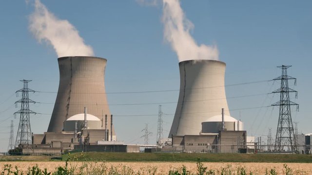 Doel Nuclear Power Station with two smoking cooling towers