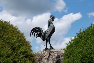 Statue of a rooster in front of a town hall in France