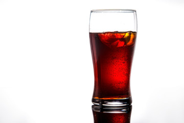 glass of cola, lemonade with ice on a white background