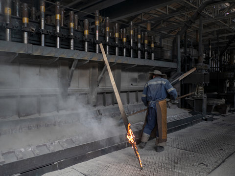 anodized aluminum electrolysis cells. fire worker. Aluminum plant. melting bucket. Safe environmental high-tech processes. Modern metallurgical plant. Melting furnace