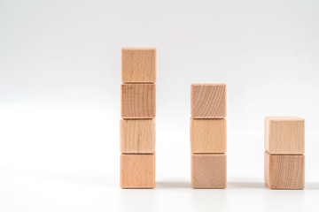 brown wood bricks tower, wood cube arrange in pyramid shape ,business concept