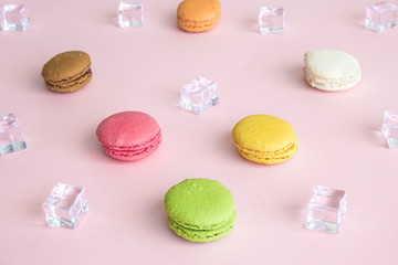 Multicolored macaroons and ice cubes abstract pattern.
