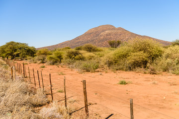 Hill mountain behind a farm fence, Namibia