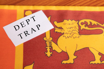 Concept of Dept trap printed on paper, Sri lankan flag as a background