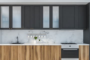 Marble kitchen close up with wooden countertops