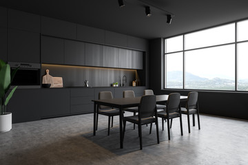 Dark gray loft kitchen corner with table