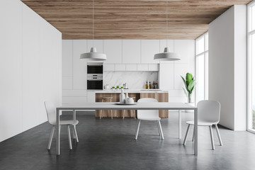Fototapeta na wymiar White kitchen interior with bar and table