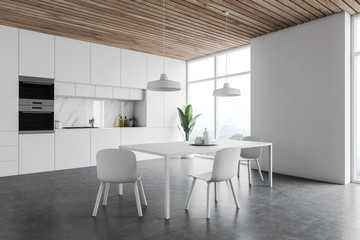 White kitchen corner, counters and table