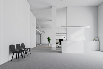 White reception desk and waiting room