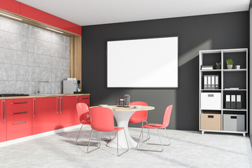 Gray and red kitchen with bookcase and poster