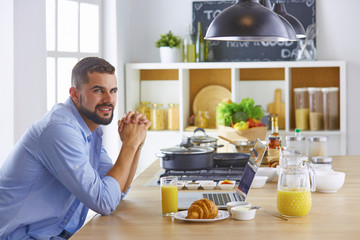 a business man breakfasts with notebook and juice